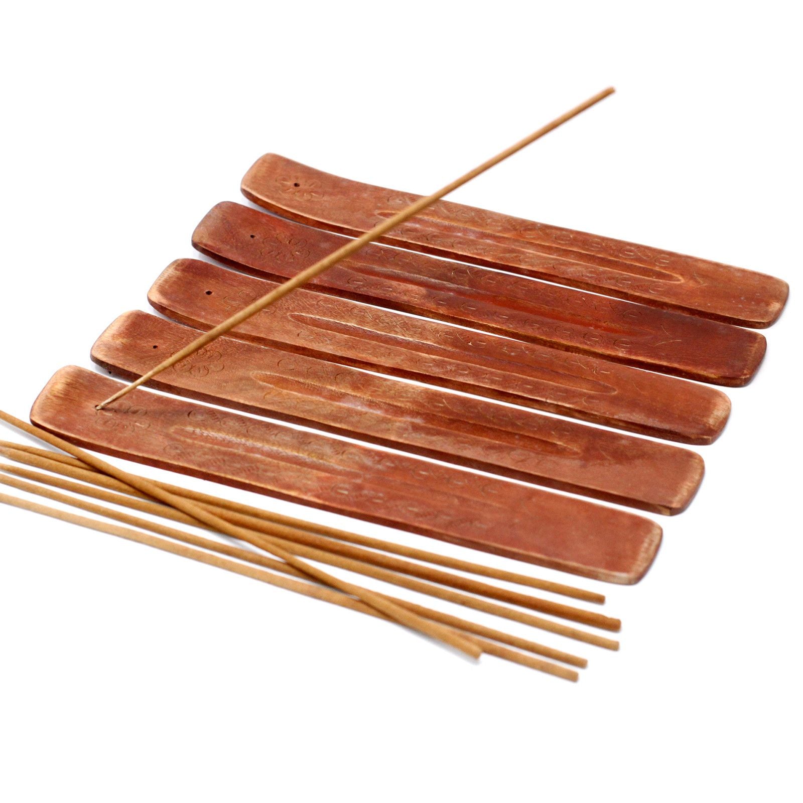 Set of wooden incense sticks on a white background