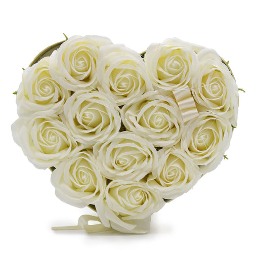 Heart-shaped arrangement of white roses on a white background
