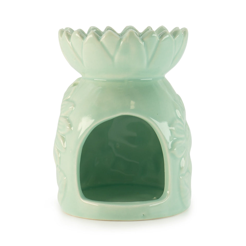 Mint green flower-shaped ceramic oil burner on a white background