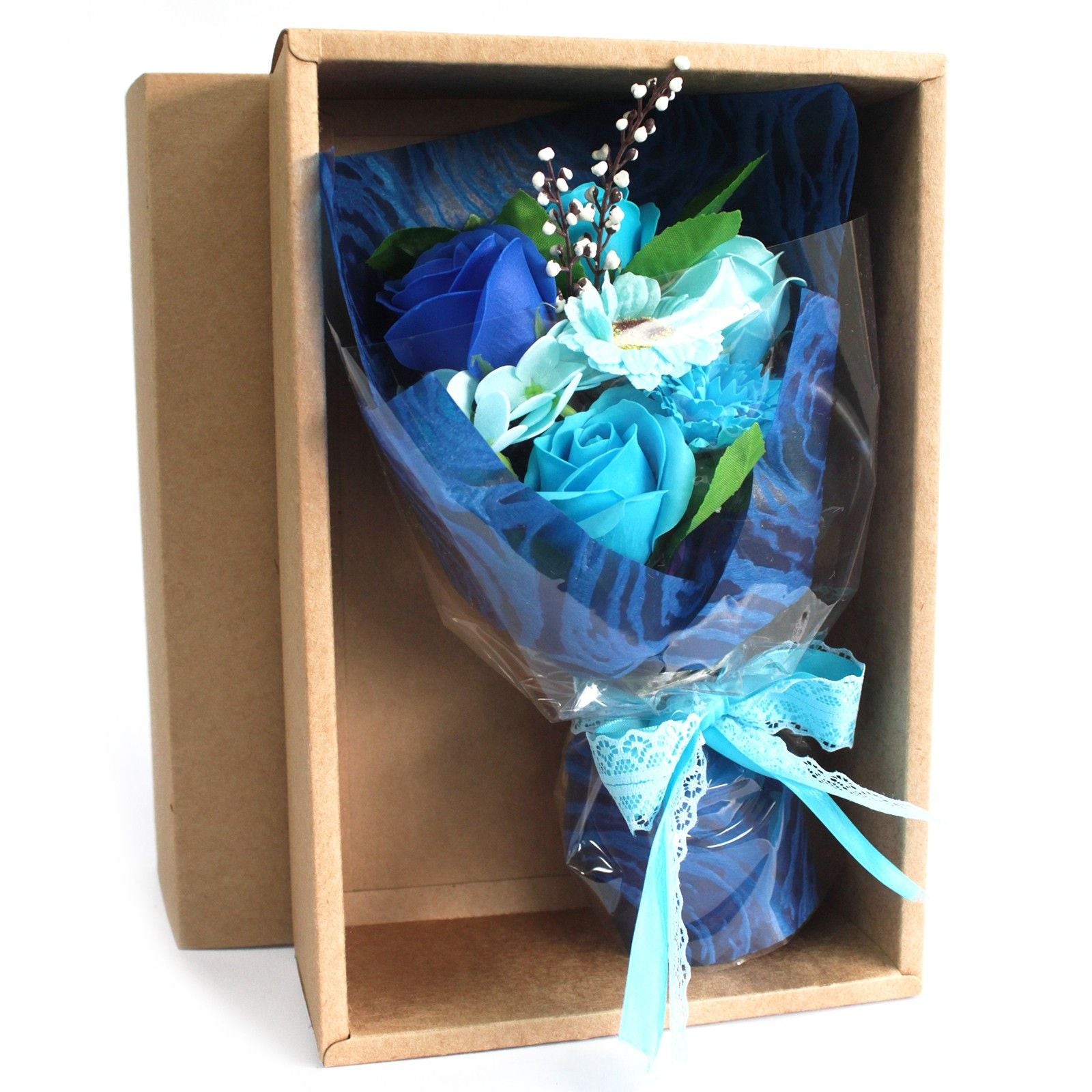 Bouquet of blue roses in a clear plastic wrap inside a cardboard box.