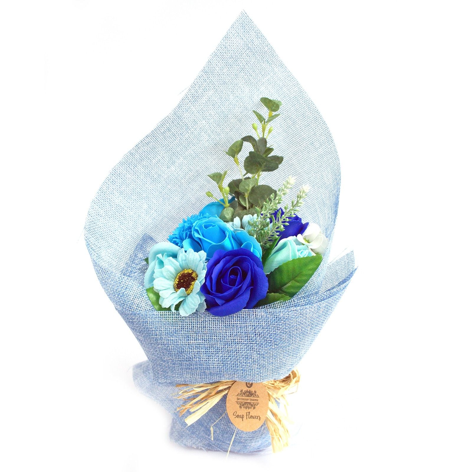 Bouquet of blue flowers wrapped in light blue paper on a white background
